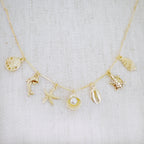 Golden Sea Charm Necklace – Shell, Dolphin & Starfish
