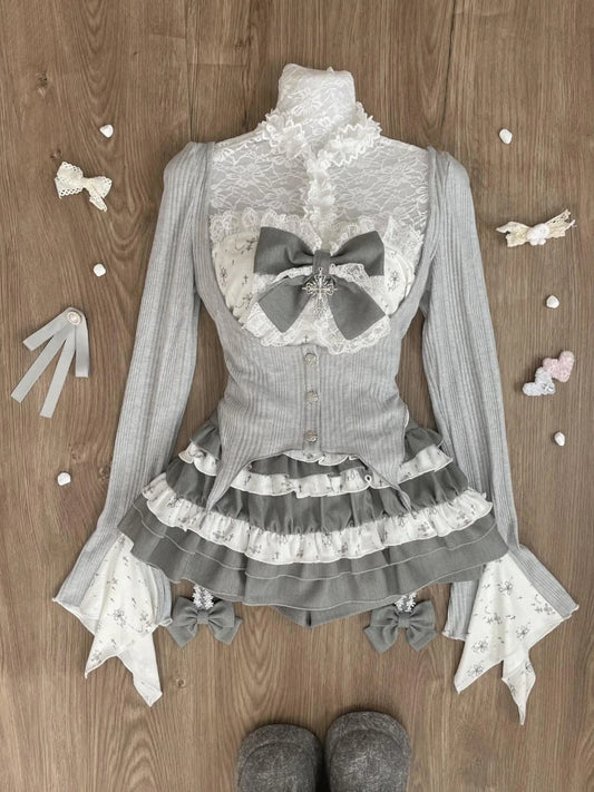 Sheer Lace High-Neck Top, Ribbed Cardigan Shrug, Lace-Up Bow Corset Vest, & Tiered Ruffle Mini Skirt with Cross Detail Set